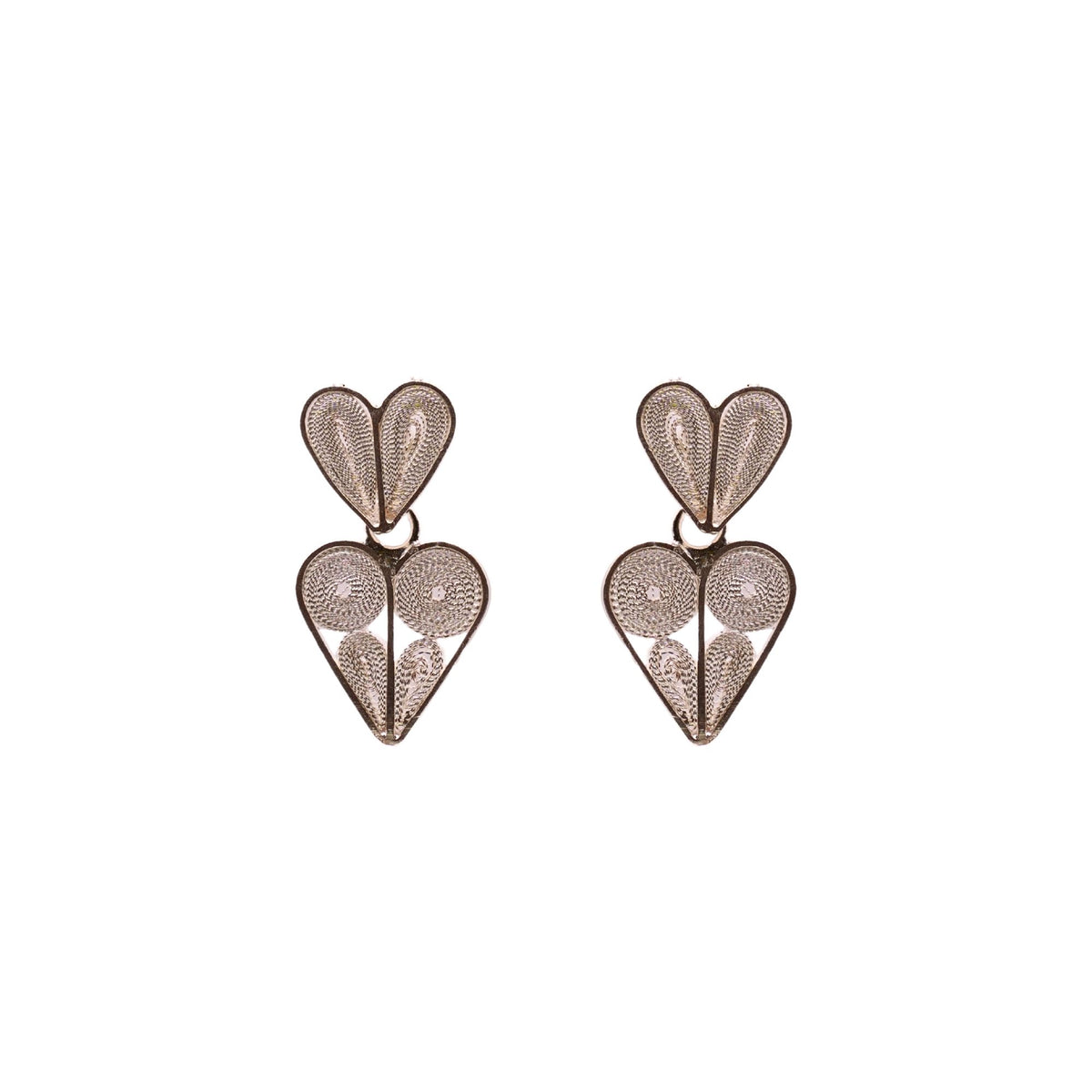Heart-shaped earrings with intricate designs on a white background
