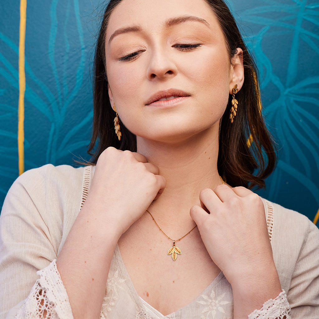 Model showing the Oh Voila Dangling Earrings and Laurel necklace