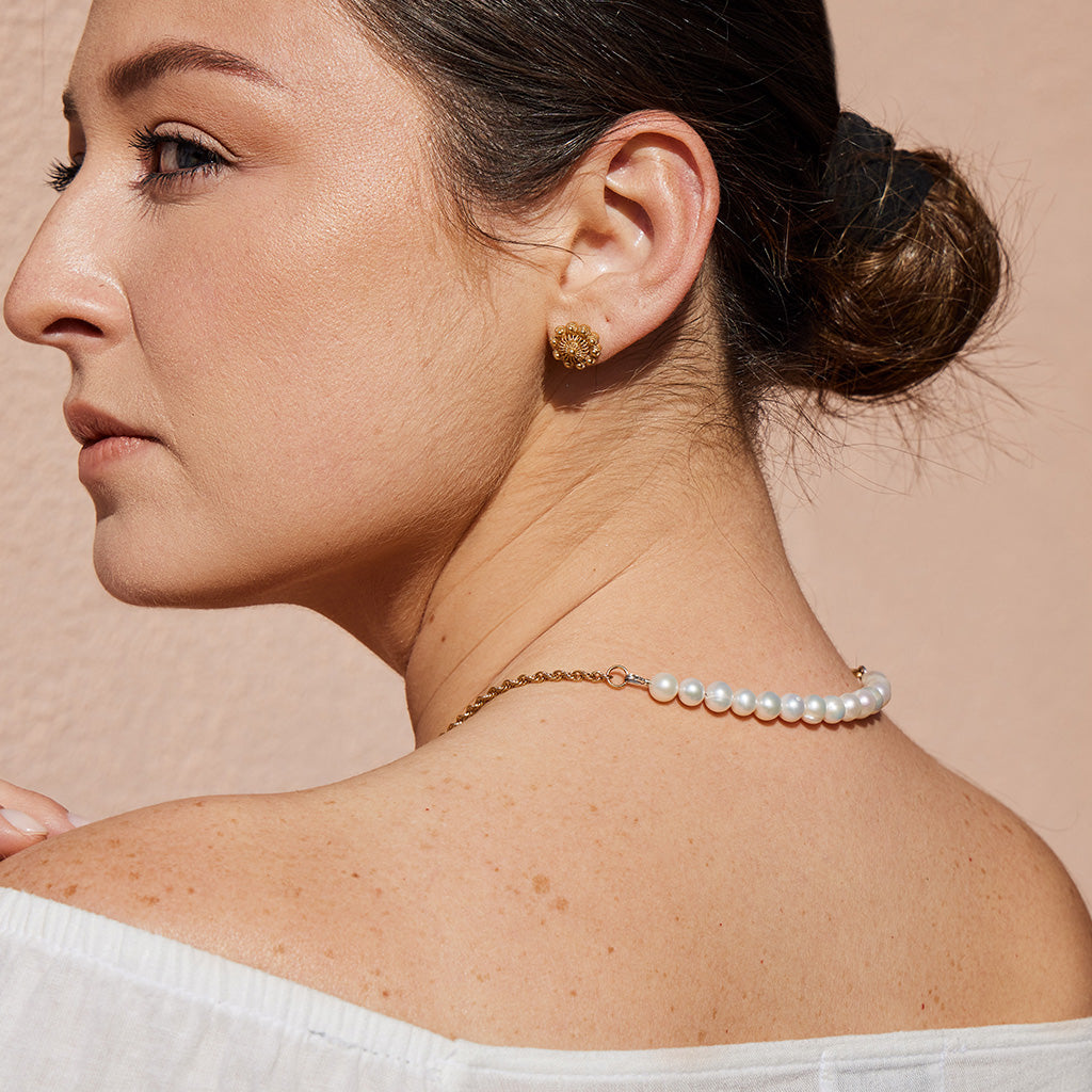 Model showing the back of the OH VOILA Coral and Pearl Necklace Gold and Daisy Earring