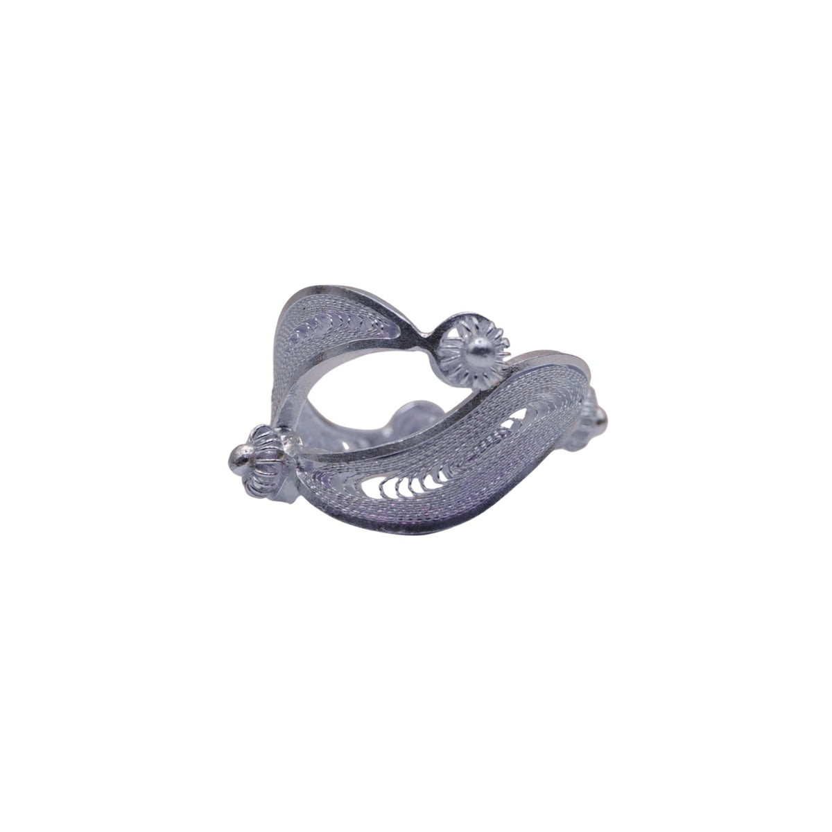 Silver ear cuff with intricate design on a white background